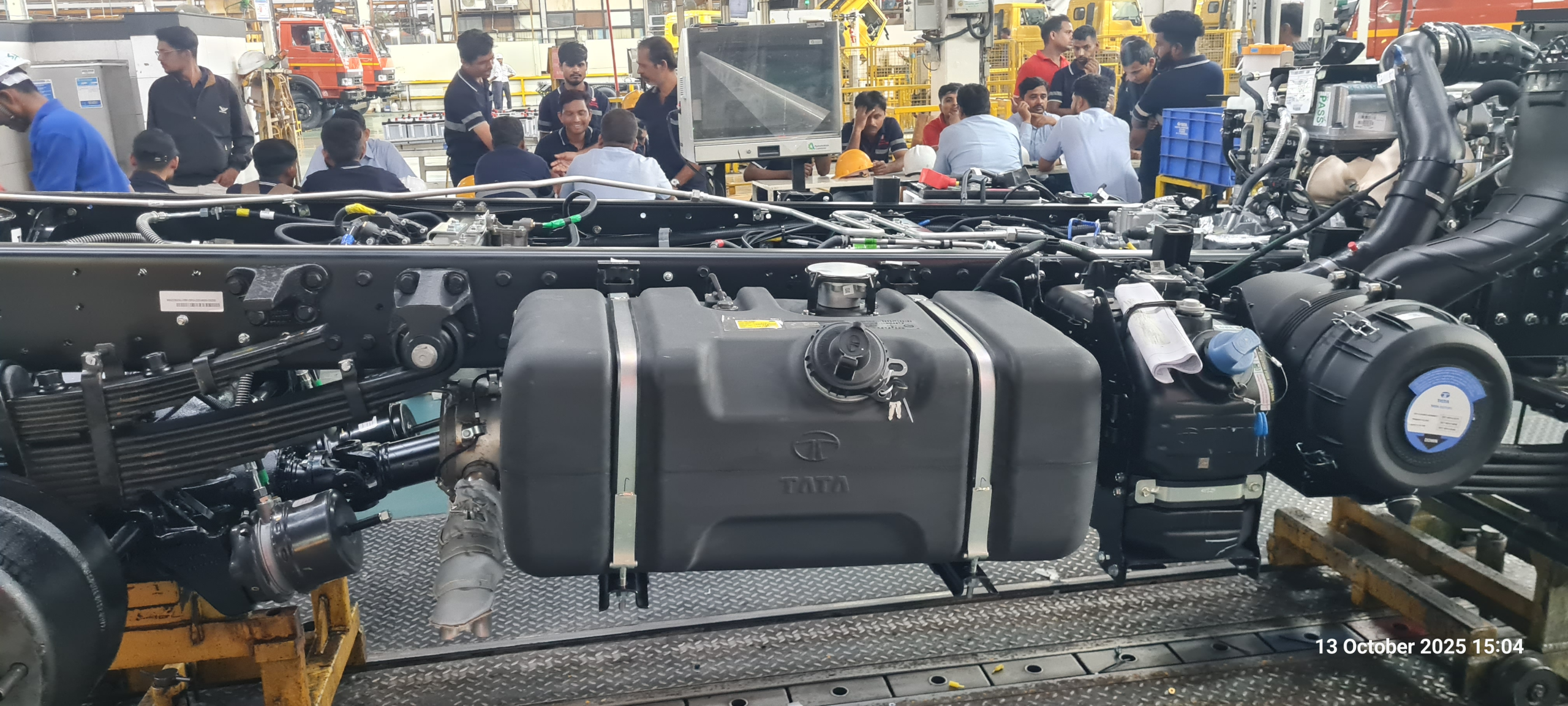 Cobot for fuel tank fitment in a vehicle assembly line
